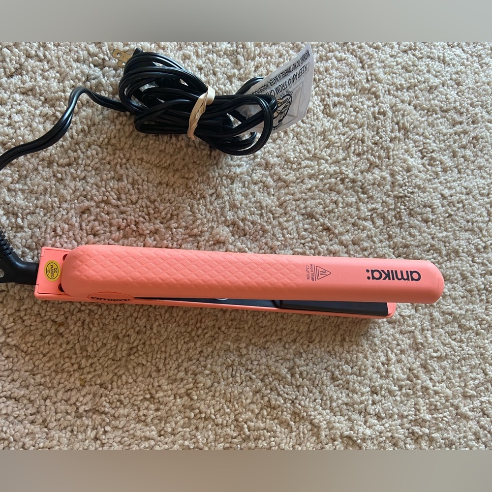 Amika full sized hair straightener. Coral in colour.